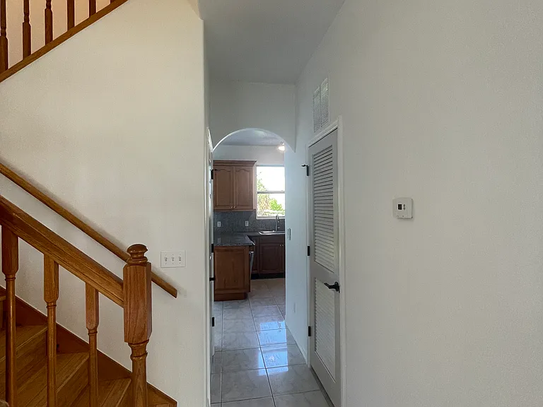 Hallway leads to the kitchen
