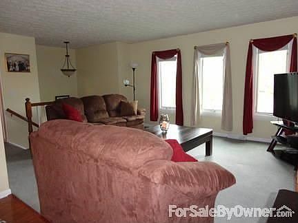 Family Room
						:
						3 large windows provide PLENTY of natural light!