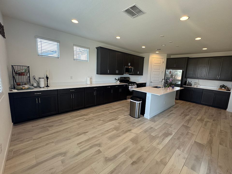 Oversized Kitchen with Walk-In Pantry, Plenty of Storage Cabinets, and Dining Space