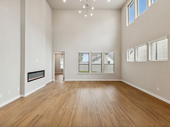 Living Room in the Da Vinci II home plan by Trophy Signature Homes - REPRESENTATIVE PHOTO