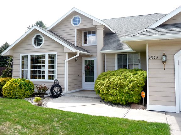 Beautiful entry with mature landscaping