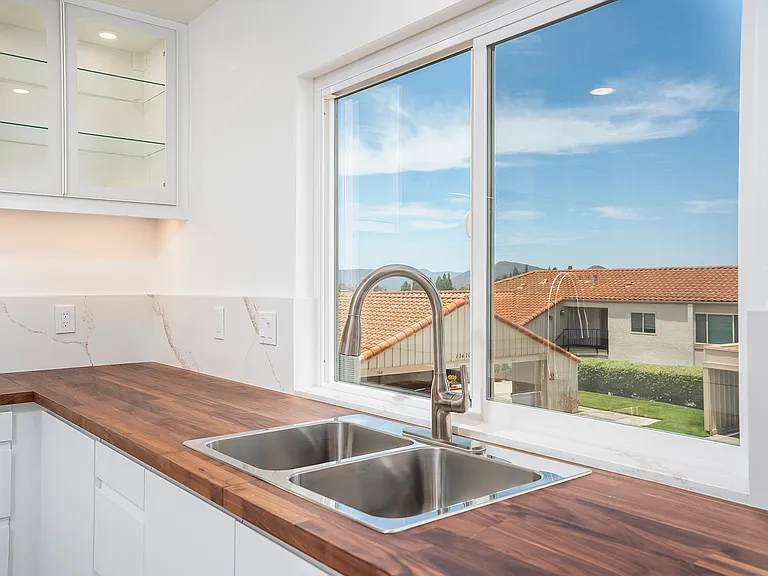 Enjoy beautiful views of the Rancho Bernardo mountain range and vibrant sunsets while working in the kitchen or cleaning up after dinner.