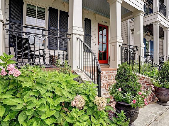 Upon entering the gated property, the brick stairs lead up to a covered front porch. Accented with wrought iron railings & shutters on each window, 440B W 17th St. is as welcoming as it is charming!