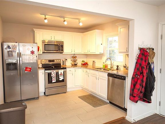 Stainless Steel Appliances/Tiled Floor