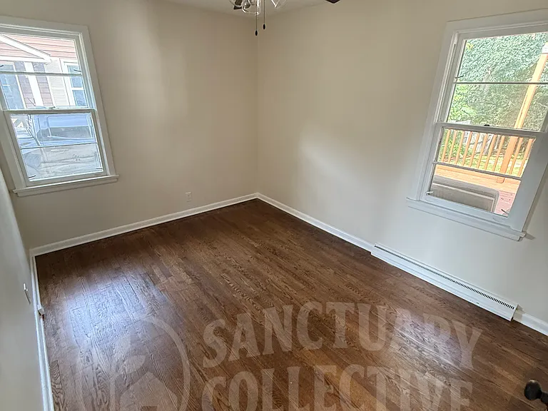 Primary bedroom w/ closet on rear side of house