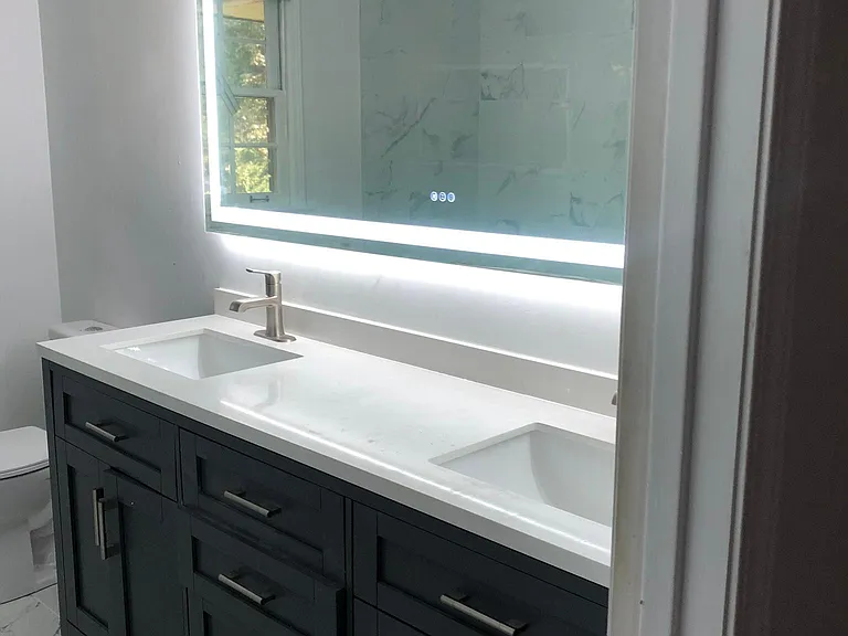 Newly Renovated bathrooms. Backlit led 72" mirror, double vanity.