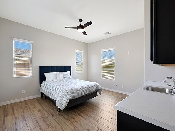 Detached casita. Bedroom and full bathroom with mini-fridge and sink.