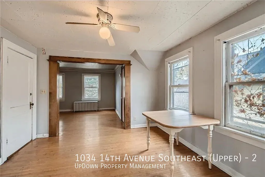 "Charming 2-Bed Upper Unit with Gleaming Hardwood Floors in Vibrant SE Como Neighborhood!" — Photo 2