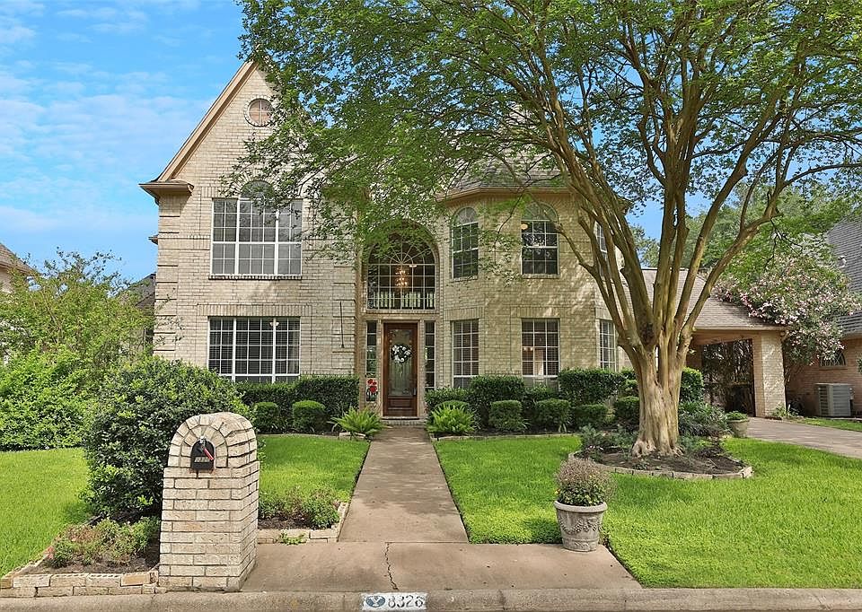 WELCOME HOME to this beautiful Champion Forest home, set on a pretty lot with lush landscaping. Check out the details in the interior photos to see all of the amazing architectural details that set this home apart.