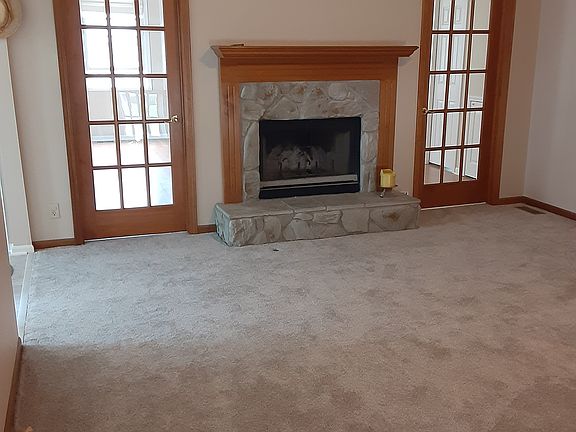 Living room with French doors to sun room
