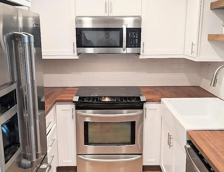Kitchen with stainless steel appliances and soft close cabinets
