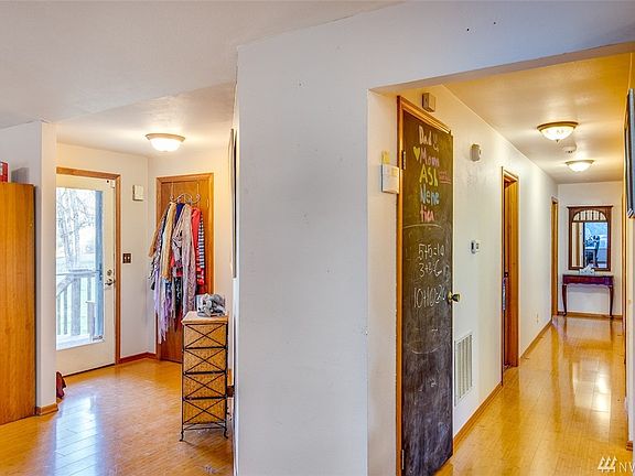 The door to the left is the front door.  The hallway leads to the bedrooms.  Beautiful Bamboo Flooring is throughout the entire home. 