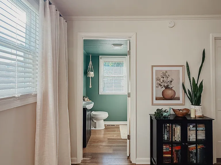 Private en-suite bath in calm sage green