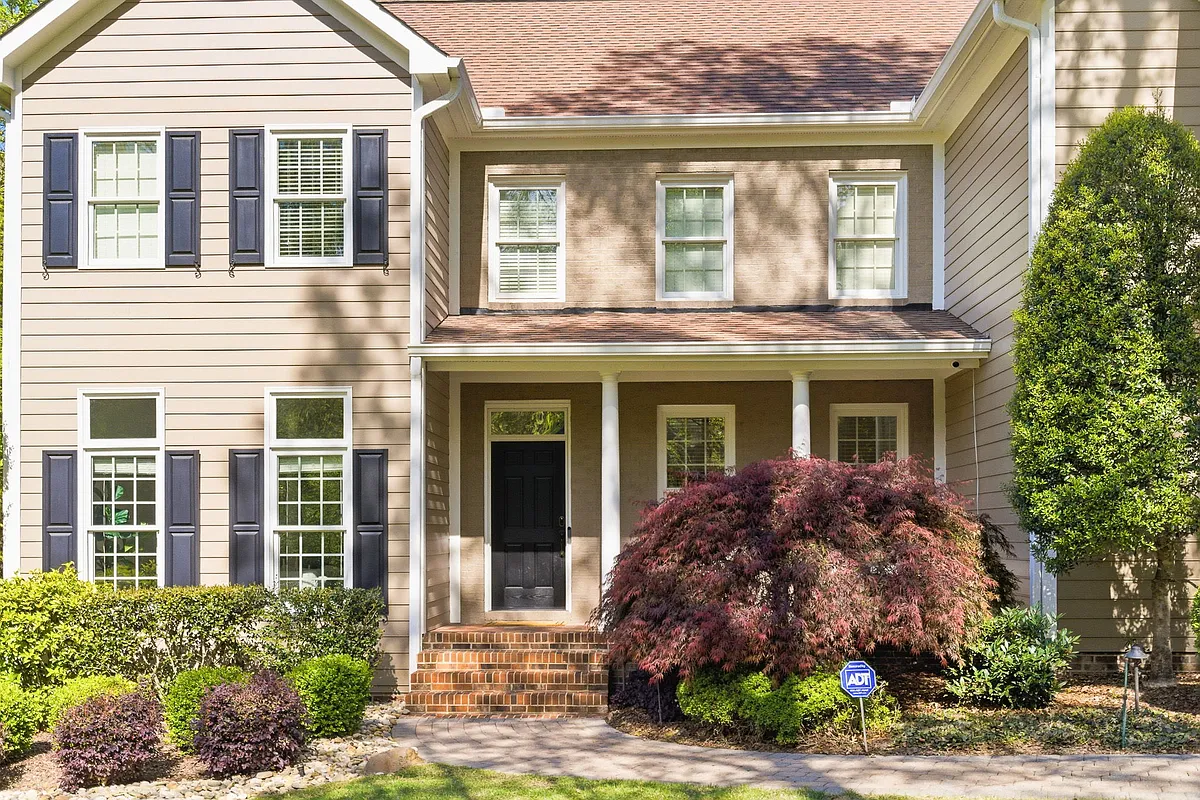 Offering a front porch sitting area. - 116 Galway Dr