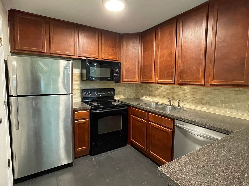 Kitchen with stainless steel fridge and dishwasher
