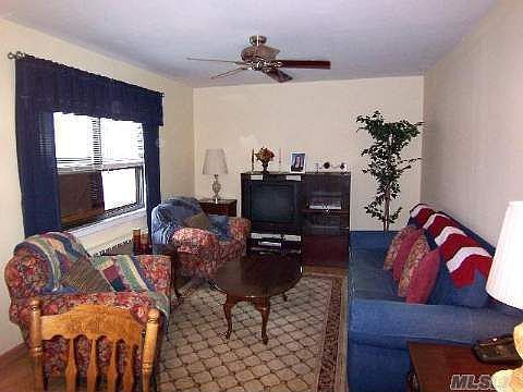 Spacious & bright living room with hardwood floors