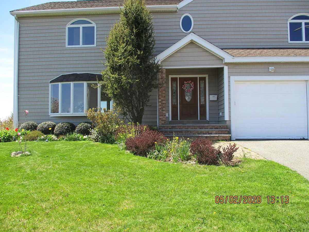 front elevation in spring - 103 Summer St