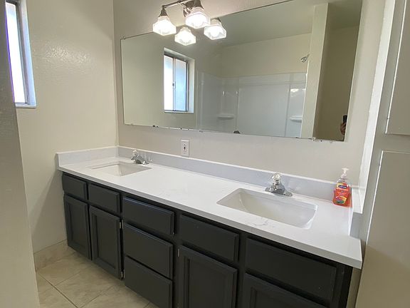 Full bathroom with double sinks