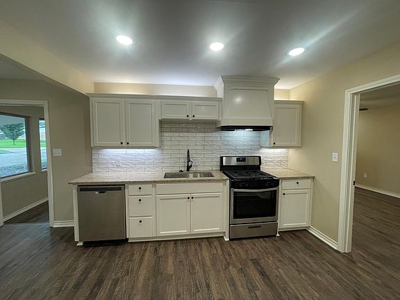 Kitchen with granite countertops.
