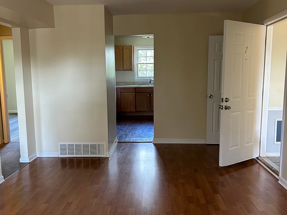 Living Room/Entrance (view of Kitchen and Hallway to Bedrooms)