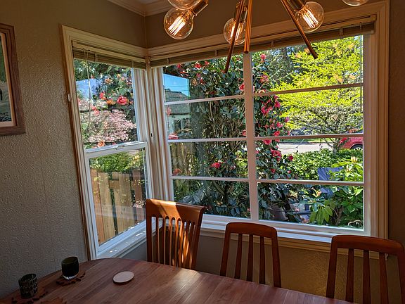 New windows in the dining room let you see the birds and the flowers