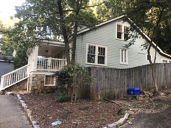 Side view featuring fenced back yard.