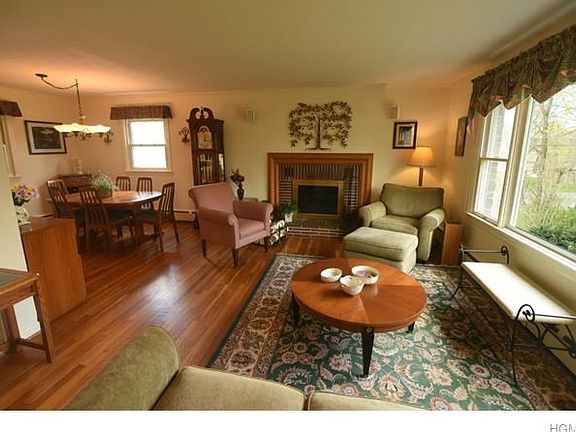 Living room w/fireplace and open floor plan. Gleaming hardwood floors.