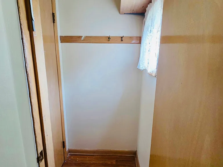 Bedroom 1 closet with entrance to attic