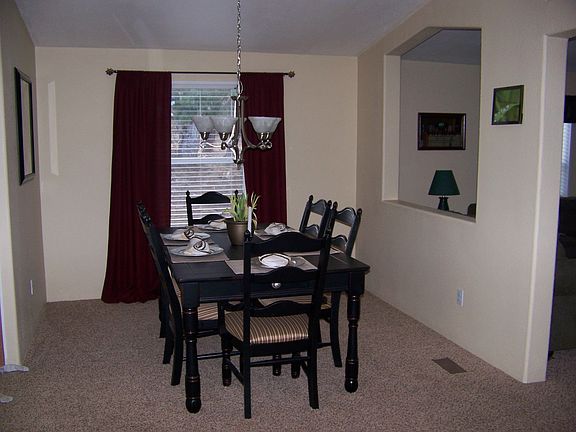 Large dining room opens into living, family, and kitchen