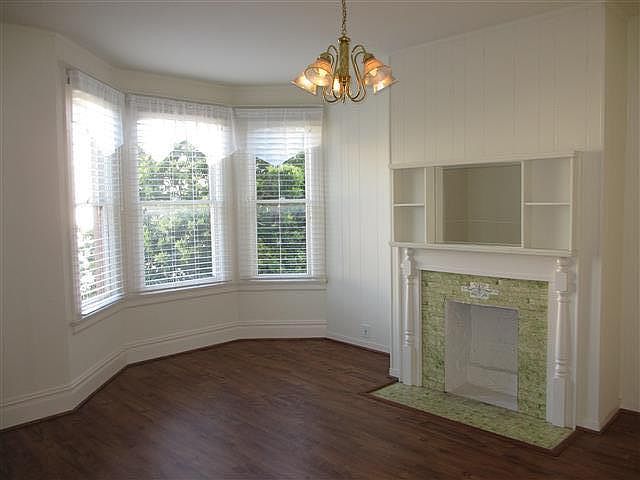 Living room with faux fireplace.