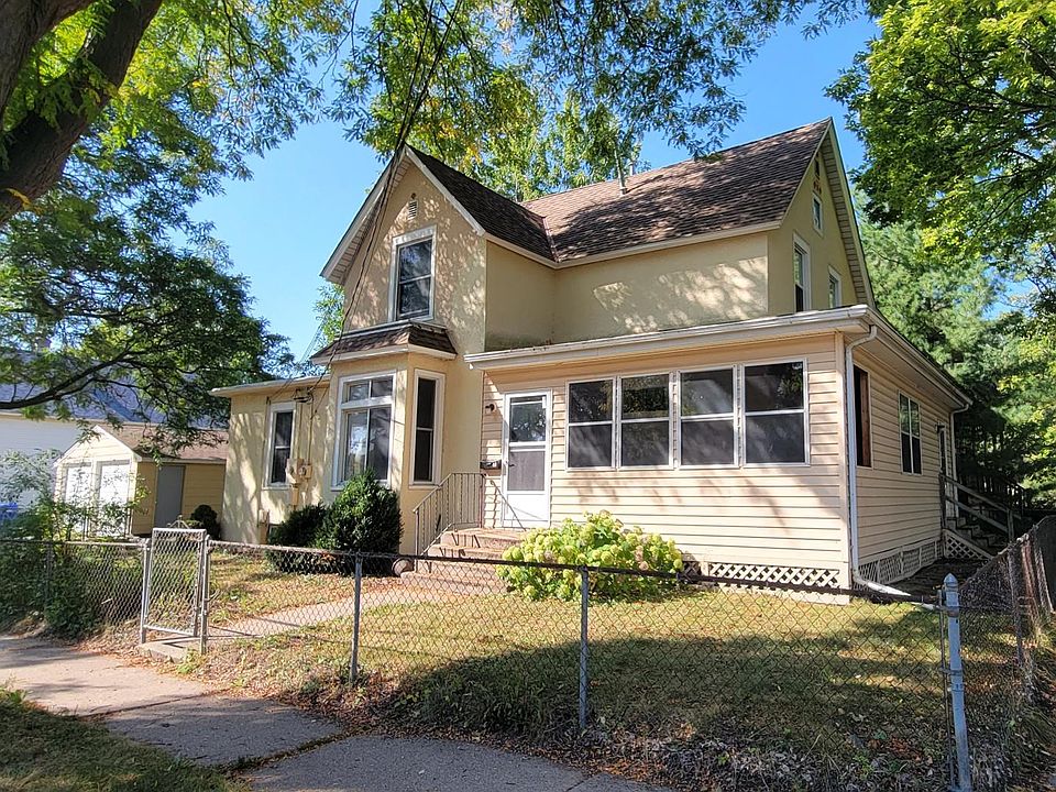 Outside view with garage and 3-season porch