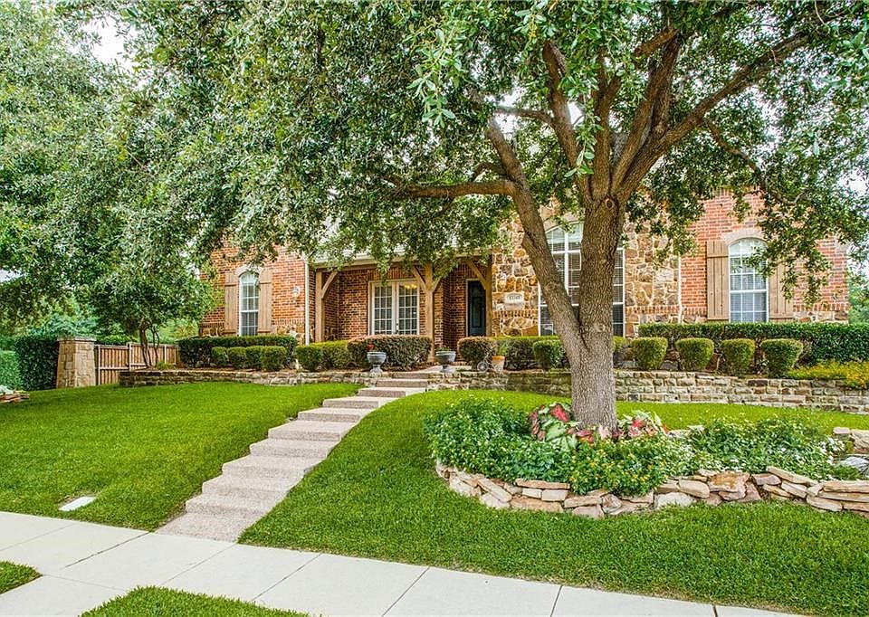 Beautifully landscaped one story with large live oak trees! Corner lot.