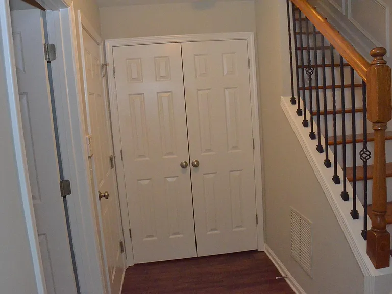 Downstairs Landing access to Garage and second Coat closet