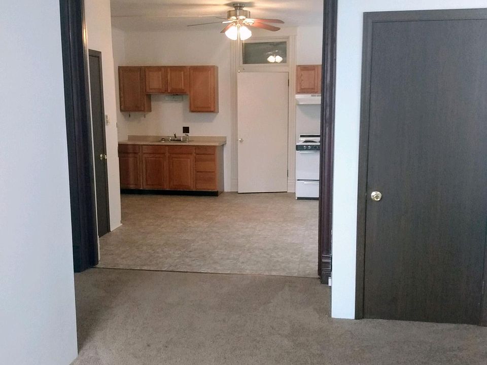 LOOKING FROM 2ND ROOM TO THE KITCHEN
