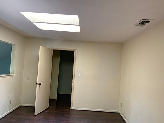 2nd floor bedroom with skylight and natural lighting