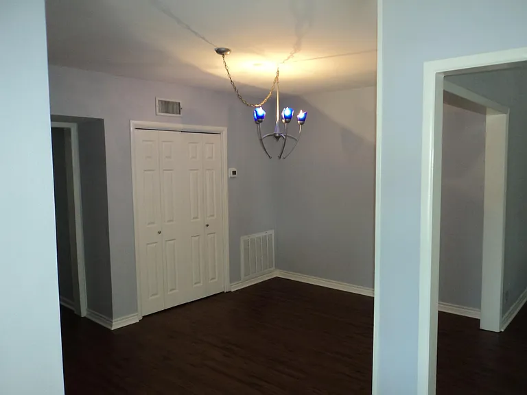Dining room with lighting by BL Guess.