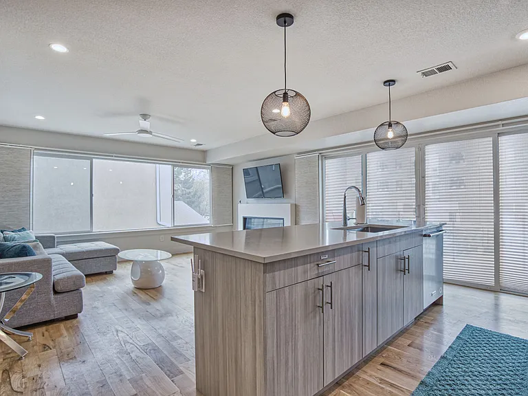 Kitchen, living room, and sliding glass doors to balcony