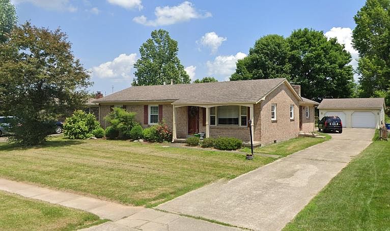 Side view of house and garage.