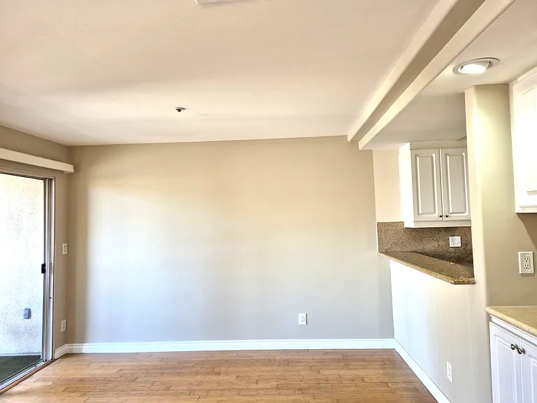 Invited greatroom with windows glass slider, walk-out balcony