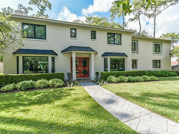 Just fabulous! This classic mid century modern home has wonderful curb appeal, nestled onto an almost half acre cul de sac lot with mature trees.