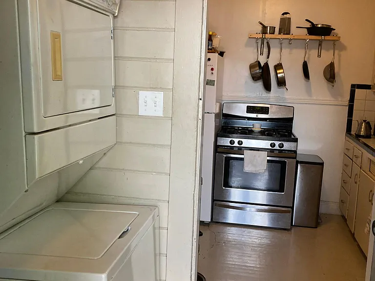 laundry room adjacent to kitchen, at back door.