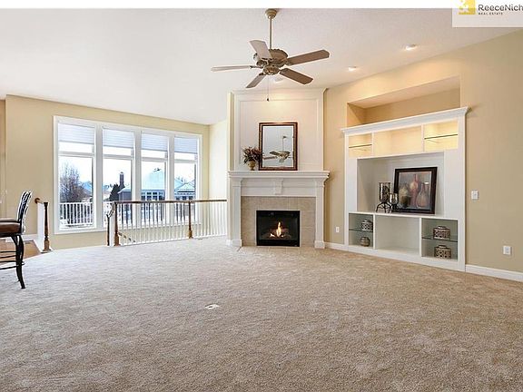 Entertain in style in this spacious great room with new carpet, gas log flip switch fireplace and heat re-circulator.  The remote control silhouette shades allow you to let in as much or as little sunlight as you choose.