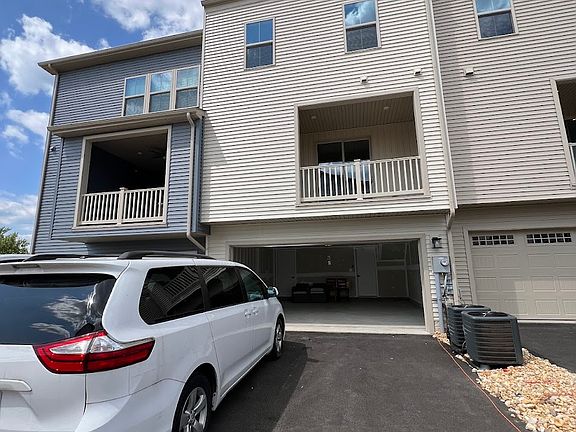 Back (garage, covered porch, top floor terrace)