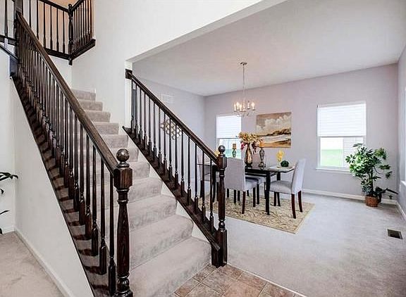GORGEOUS 2 ST0RY ENTRY WITH CUSTOM WOOD STAIRCASE
