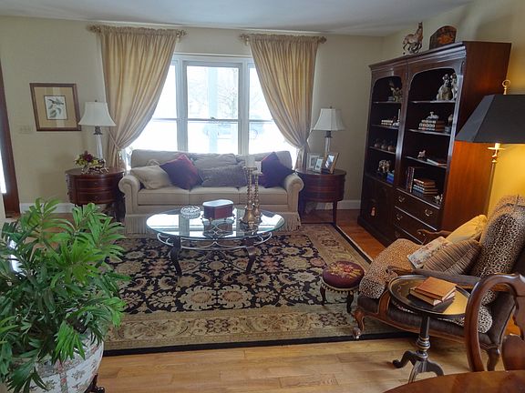 The large picture window in the living room overlooks the front porch.