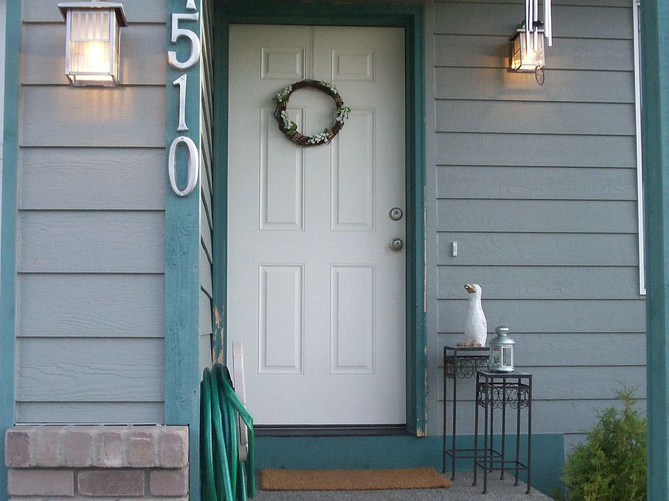 Lantern Style Porch Lights with Bold Numbering in a Nickel Finish.