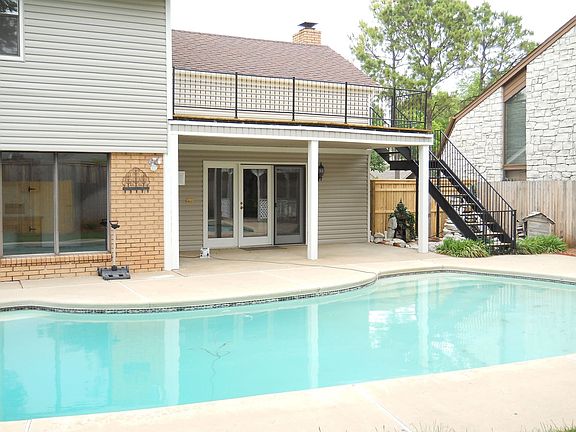 Backyard showing Pool and Balcony