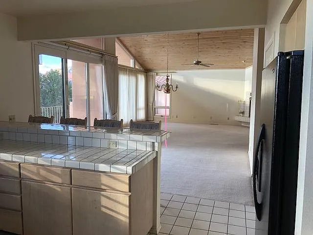 Dining and living room in background as viewed from kitchen