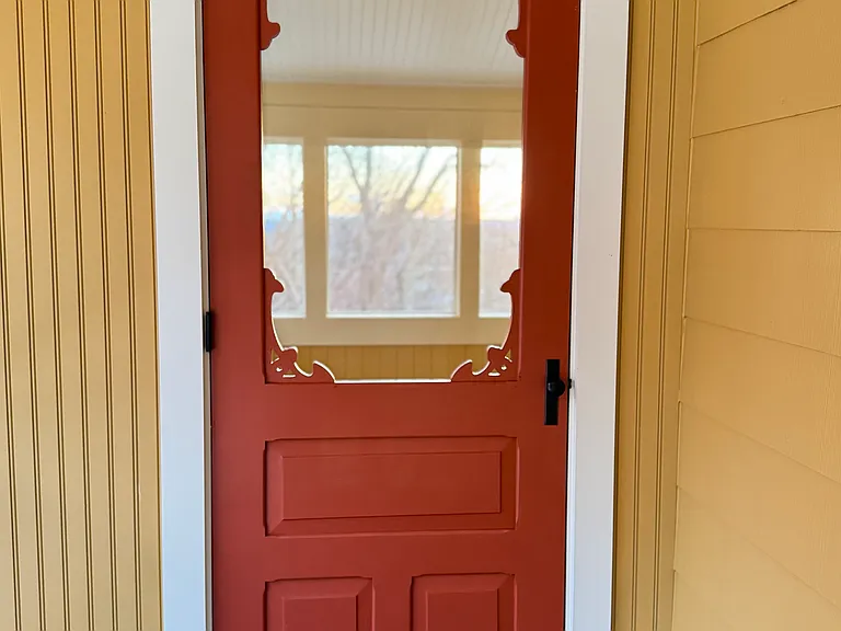 This door leads from the 2nd floor balcony into the three season porch.