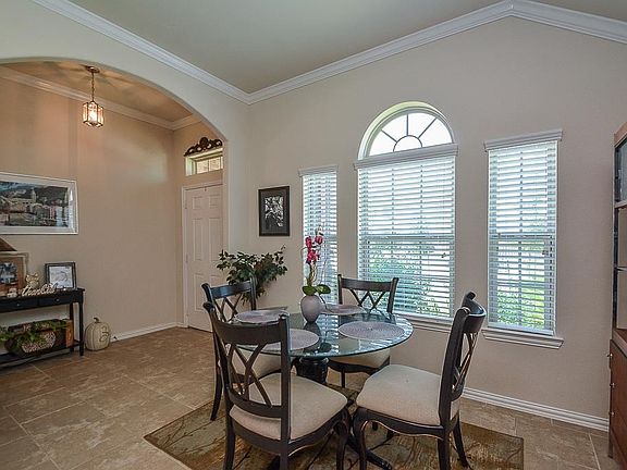 From breakfast nook looking towards front door and out window into front yard.